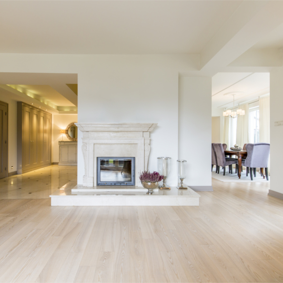white living room with light wood floors